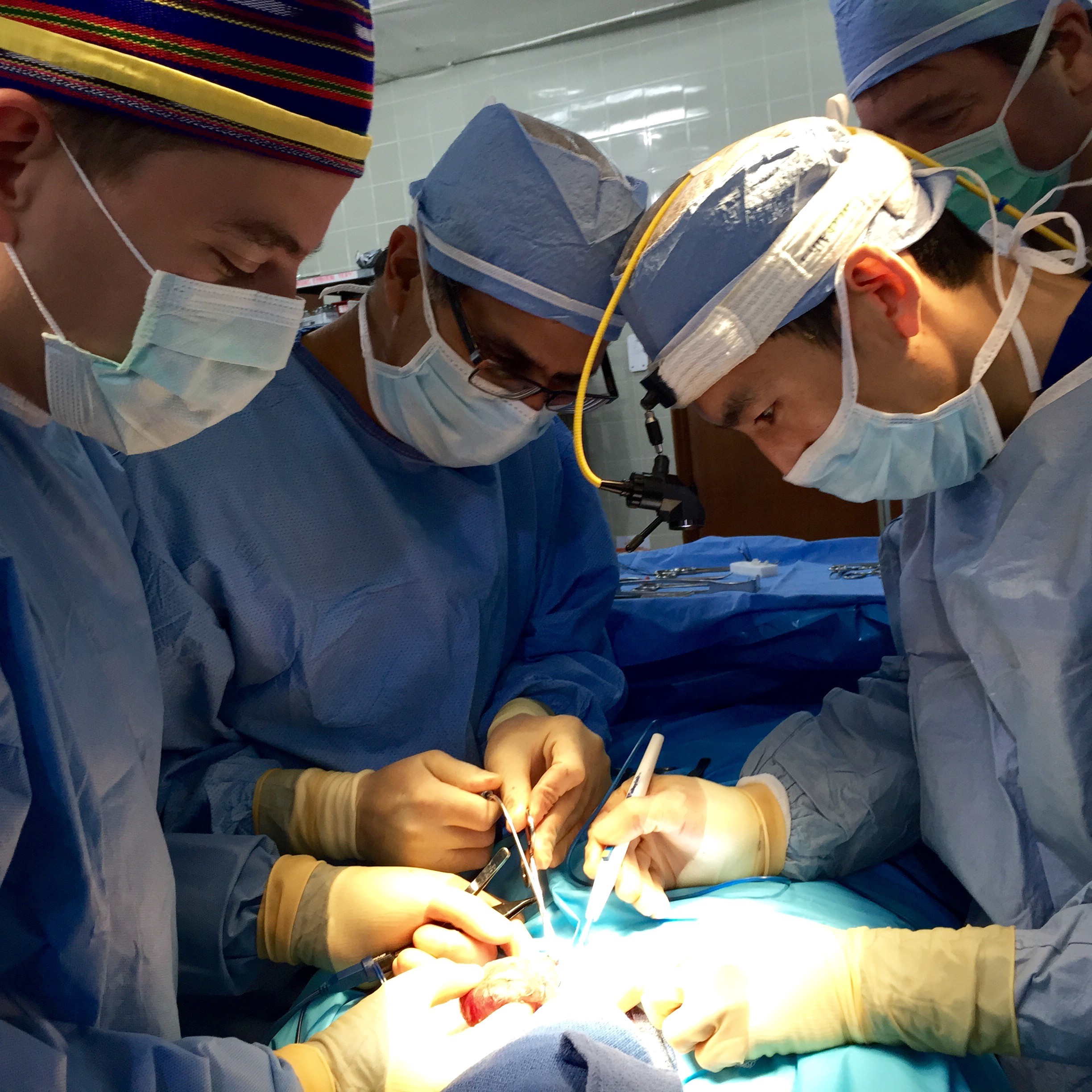 Another look at the Head and Neck Surgery team working in concert in the excision of a thyroid goiter.